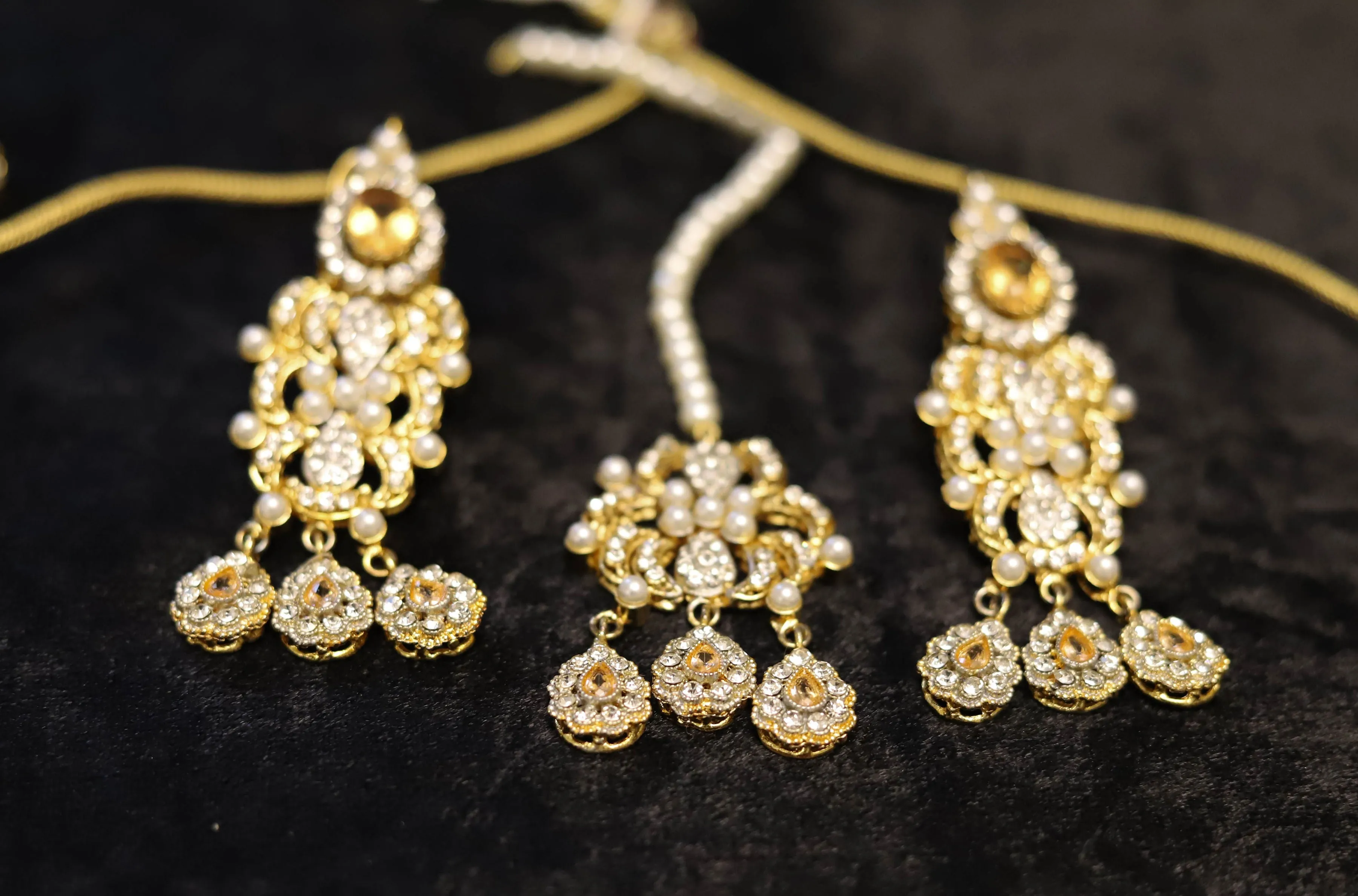 Champagne color kundan choker set with jhoomar and tikka