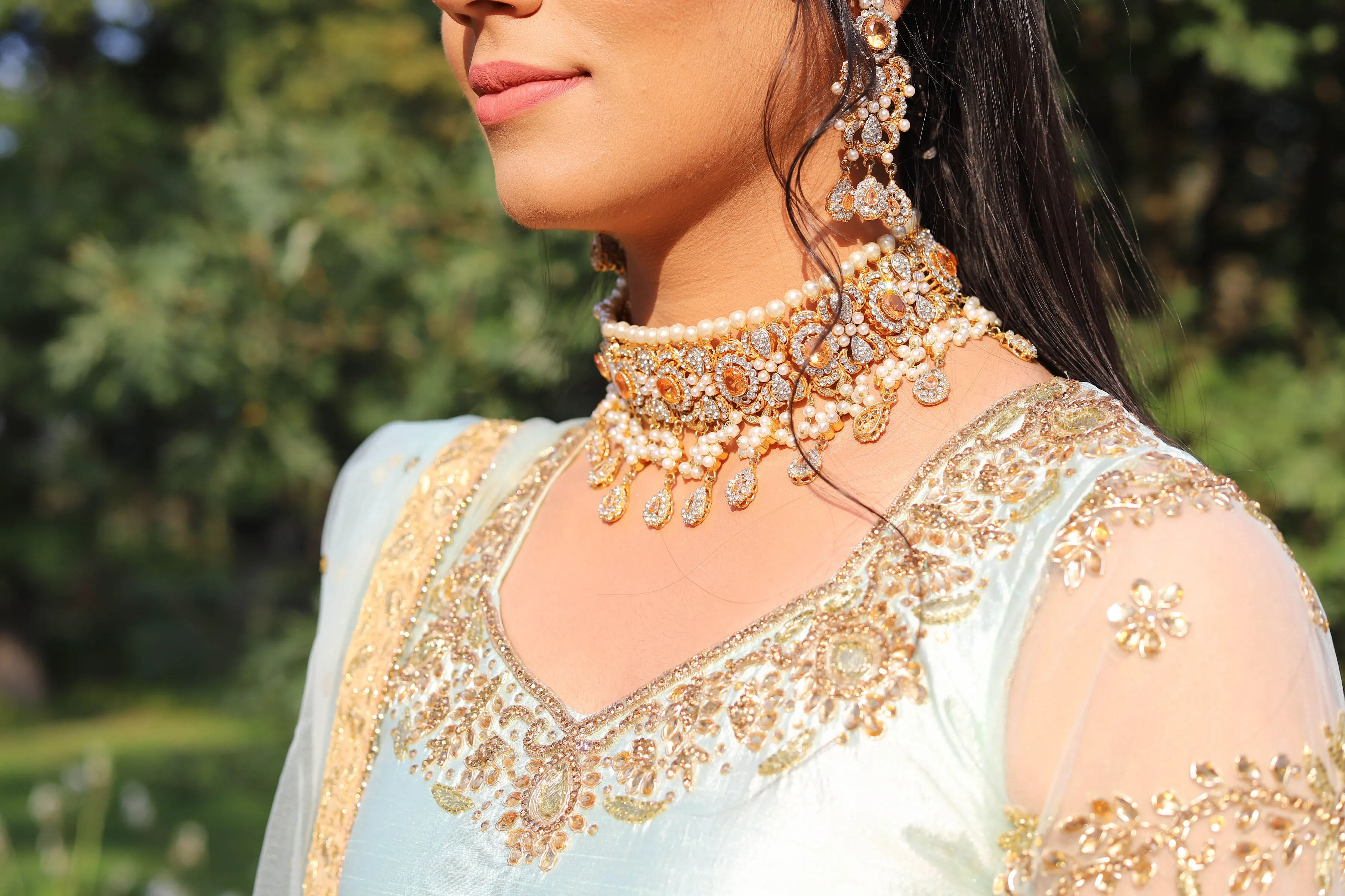 Champagne color kundan choker set with jhoomar and tikka